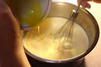 mixing eggs, milk, and flan powder