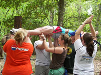 CFFA members working as a team to complete the rope course.