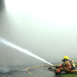 ACFR firefighter puts water on the hose