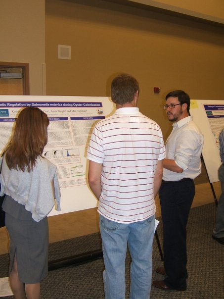 Pic of my mentor presenting a poster